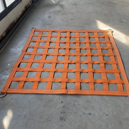 Webbing cargo lifting net in orange polyester webbing with 100 mm square mesh laid out flat
