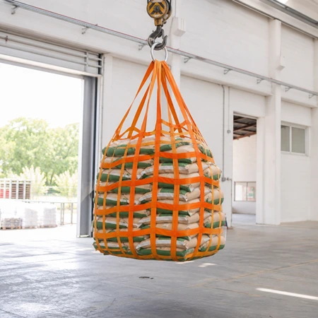 Detail of a webbing cargo lifting net corner, showing 50 mm orange webbing bands, 100 mm mesh and the reinforced stitched corner loop